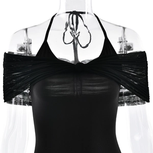 Detail of black mesh halter neck dress showing the knot design and off-shoulder neckline
