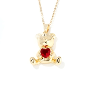Golden teddy bear necklace with red heart-shaped zircon pendant on white background