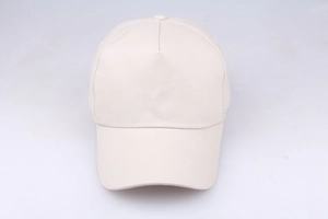 Detail of a beige five-panel baseball cap showing fine fabric texture and front stitching