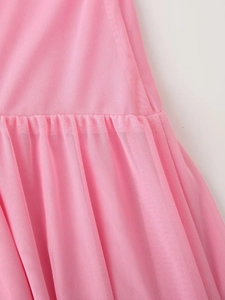 Close-up of pink mesh fabric showing pleated details and textured stitching on the dress