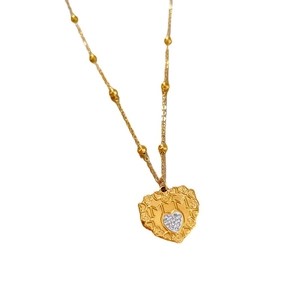 Gold titanium steel heart necklace with MOM engraving and crystals on white background