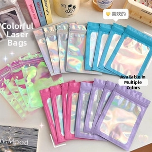 Detailed view of colorful laser iridescent heart bubble mailers for gift packaging