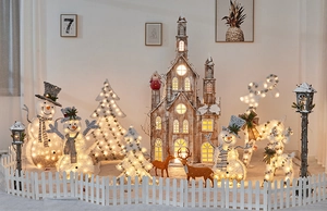 Cozy Christmas scene with glowing snowman, wooden church, and reindeer decor