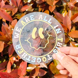 Rainbow suncatcher window cling with yellow smiley face and positive quote text