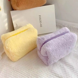 Soft plush makeup bags in yellow and purple macarons colors with smooth zipper closure
