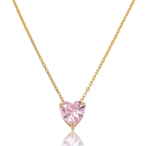 Detailed view of pink heart zircon pendant with golden chain and classic prong setting