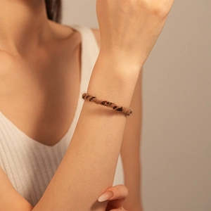 Close-up of leopard print faux fur cuff bracelet with soft texture on a woman's wrist