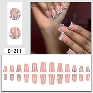 Pink press-on nails with glitter plaid pattern and butterfly rhinestone accents