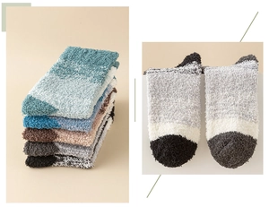 Detailed view of assorted gradient coral fleece sleeping socks in multiple colors