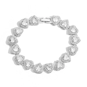 Macro shot of silver heart links encrusted with sparkling cubic zirconia on a luxury bracelet