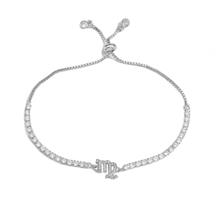 Macro detail of silver Virgo zodiac adjustable bracelet with brilliant white crystals