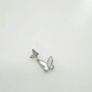 Detail of 18K gold-plated double butterfly pendant with shell inlay and zircons