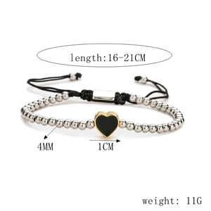 Detail showing adjustable black woven rope bracelet with heart pendant and silver beads