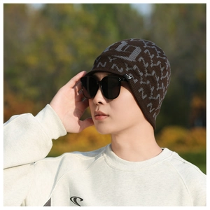Detail of winter beanie for men with ear flaps and gray letter patterns for cold weather