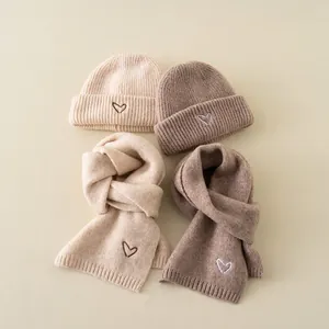 Cozy knit beanie and scarf set for children with heart embroidery in beige and brown