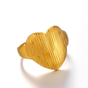 Golden heart-shaped stainless steel ring featuring vertical striped texture and polished band