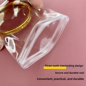 Detail of reinforced triple-track zip lock seal on clear PVC jewelry storage bag