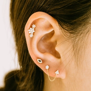 Elegant gold S925 silver ear cuff set with flower leaf studs and hanging chain detail