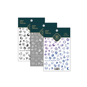Three-pack starry galaxy nail stickers with astronaut and heart designs in matte finish