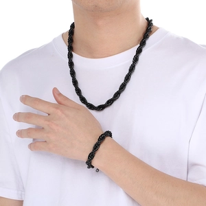 Detailed shot of black 10mm stainless steel twist chain necklace and bracelet set for men