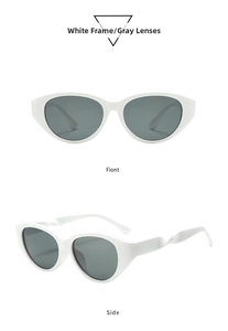 Detailansicht der weißen Cat-Eye-Sonnenbrille mit gedrehten Bügeln und grauen Gläsern