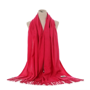 Bright pink cashmere feel winter scarf with fringe detail, cozy and warm fashion accessory.
