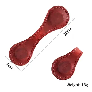 Handmade crazy horse leather magnetic bookmark and cable organizer in dark red leather