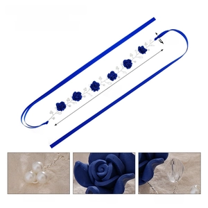 Detail view of blue polymer clay flowers and faux pearls on bridal headband with dimensions