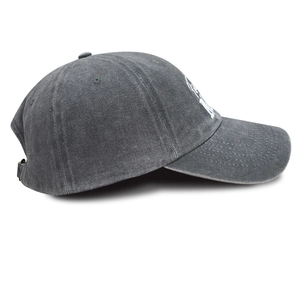 Detailed side view of washed vintage grey baseball cap with embroidery and metal buckle