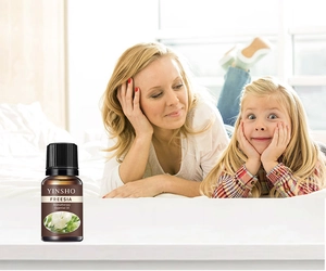 Detailed view of plant essential oil bottle featuring fresh freesia aroma for home aromatherapy.