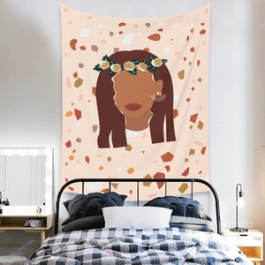 Detail of bohemian wall tapestry featuring abstract woman portrait on terrazzo background
