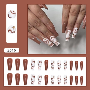 Long ballerina press-on nails in brown and white with heart and star patterns