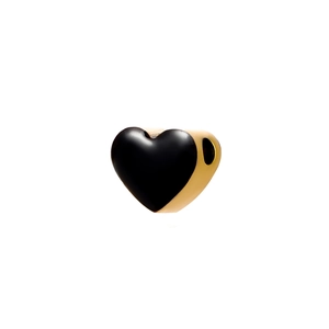 Macro view of a gold heart charm bead with black enamel finish for DIY jewelry