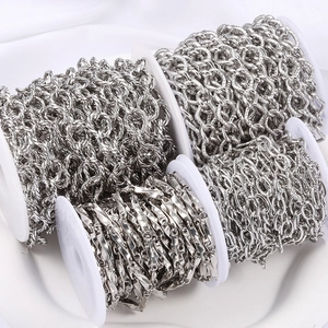 Polished silver stainless steel DIY jewelry chains on white spools in various styles