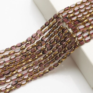 Detailed view of 4x6mm golden edged purple gradient oval glass beads for DIY jewelry