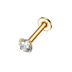 Macro detail of a single gold stainless steel stud with sparkling clear zircon stone