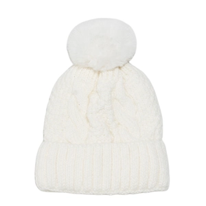Close-up of white cable-knit beanie with large faux fur pompom and ribbed cuff detail