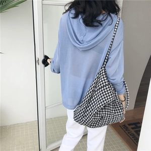 Fresh light blue knitted hoodie paired with a red and white gingham canvas crossbody bag