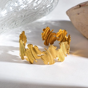 Minimalist 18k gold plated stainless steel open cuff bracelet with tropical leaf pattern