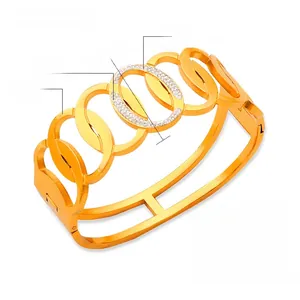 Detail view of titanium steel gold bracelet featuring Czech diamonds and colored ceramic glaze