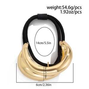 Detail view of golden geometric hair tie with dimensions and 54.6g weight specs