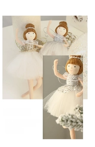 Detailed view of plush Christmas angel dolls with sequined tulle skirts and pearl headbands