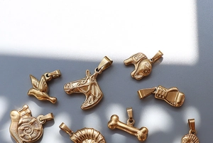 Collection of 18K gold plated vintage animal charms including horse, elephant and bird