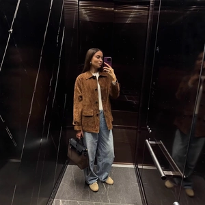 Maillard brown suede vintage jacket with oversized pockets shown in mirror selfie