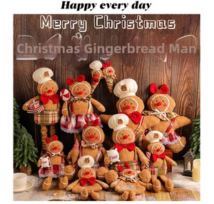 Macro detail of gingerbread man plush toys in festive outfits for Christmas decor