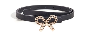 Macro shot of a curled black leather belt with a polished gold metal decorative buckle