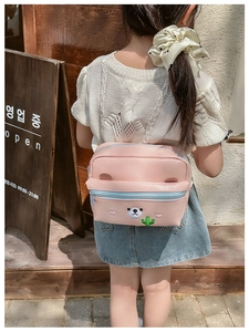 Detail of pink PU leather kids bag with cute bear embroidery and blue zipper accents