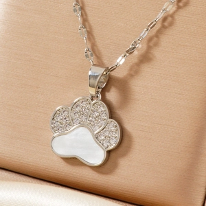 Elegant silver bear paw pendant necklace with sparkling zircons and mother of pearl inlay
