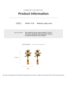 Detail showing vintage gold flower earrings with orange resin drops, weight 37.2g