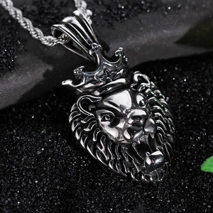 Close-up of silver stainless steel roaring lion king pendant with crown on twist chain
